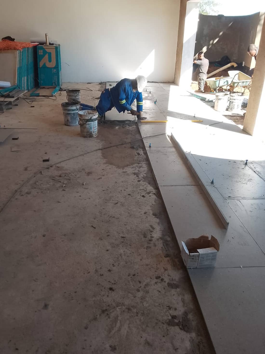 Ishie team completing a floor tiling installation
